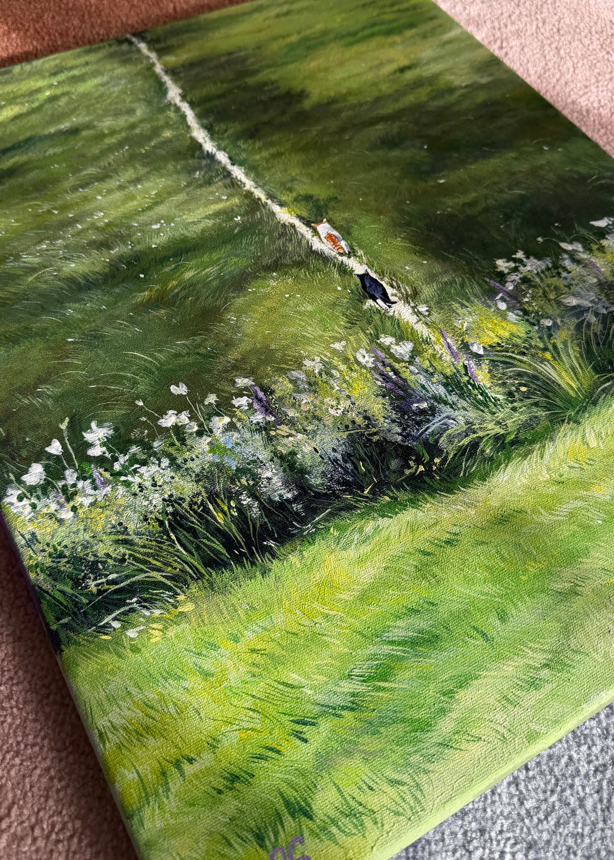 Painting of a landscape with green fields and a path. 